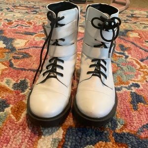 White boots. Adjustable straps with diamonds. Black lace tie Zipper on side